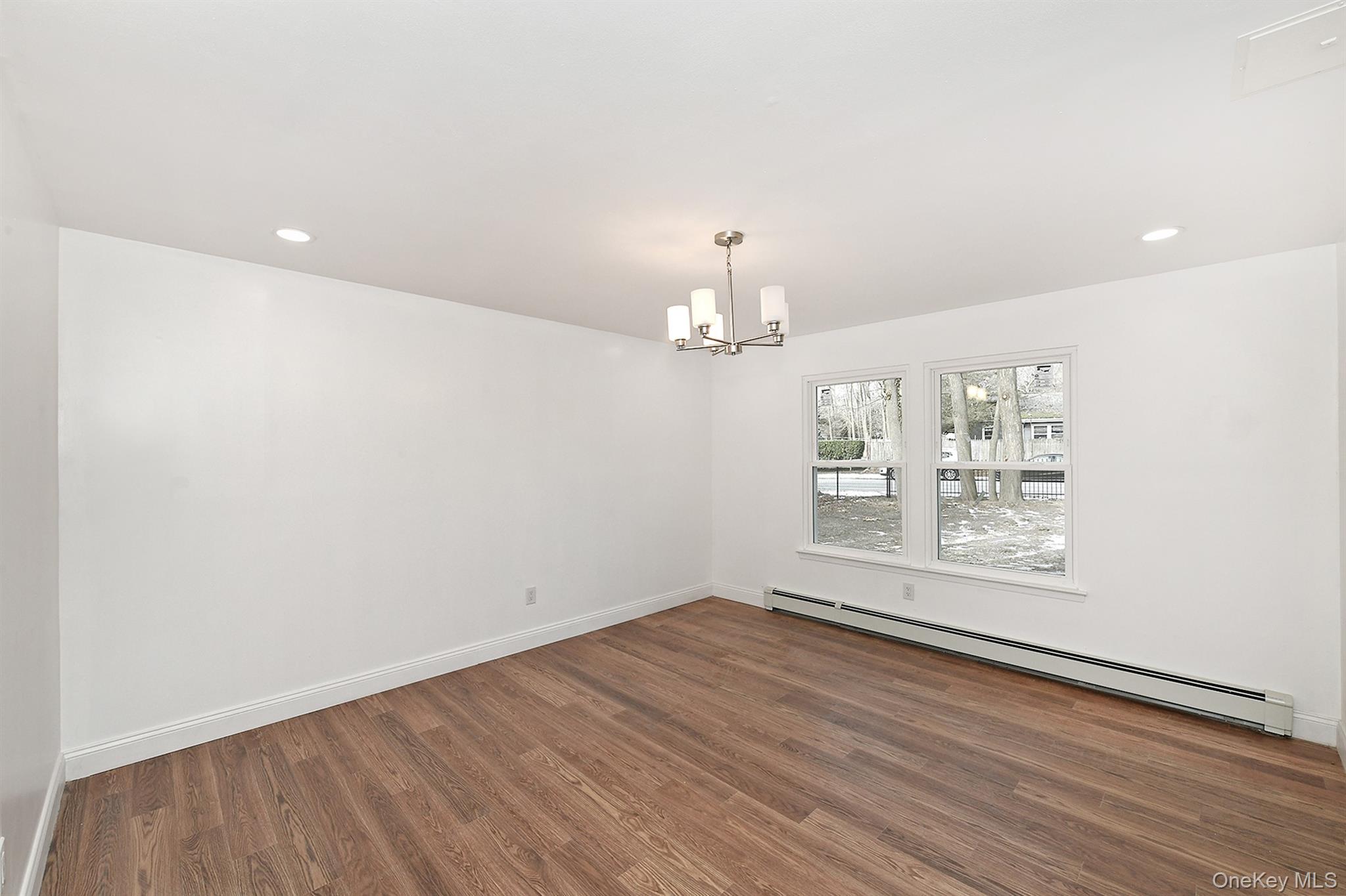 34 Warner Road Huntington, NY 11743 - Photo 17 of 39 wooden floor in an empty room with a window