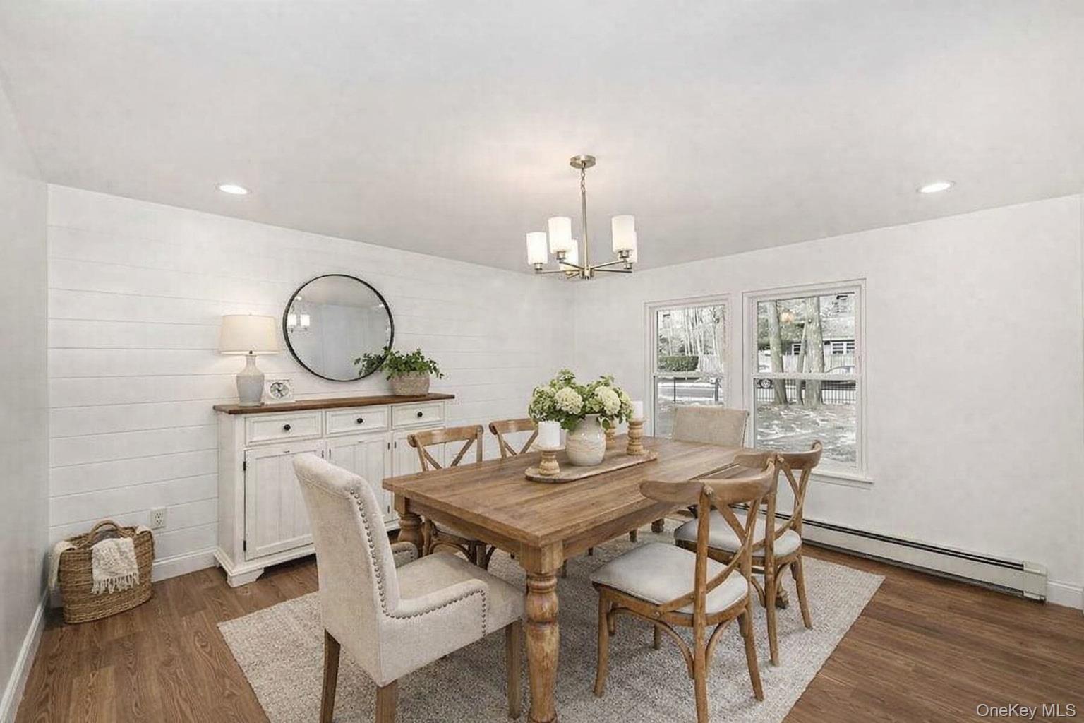 34 Warner Road Huntington, NY 11743 - Photo 18 of 39 a view of a dining room with furniture and wooden floor