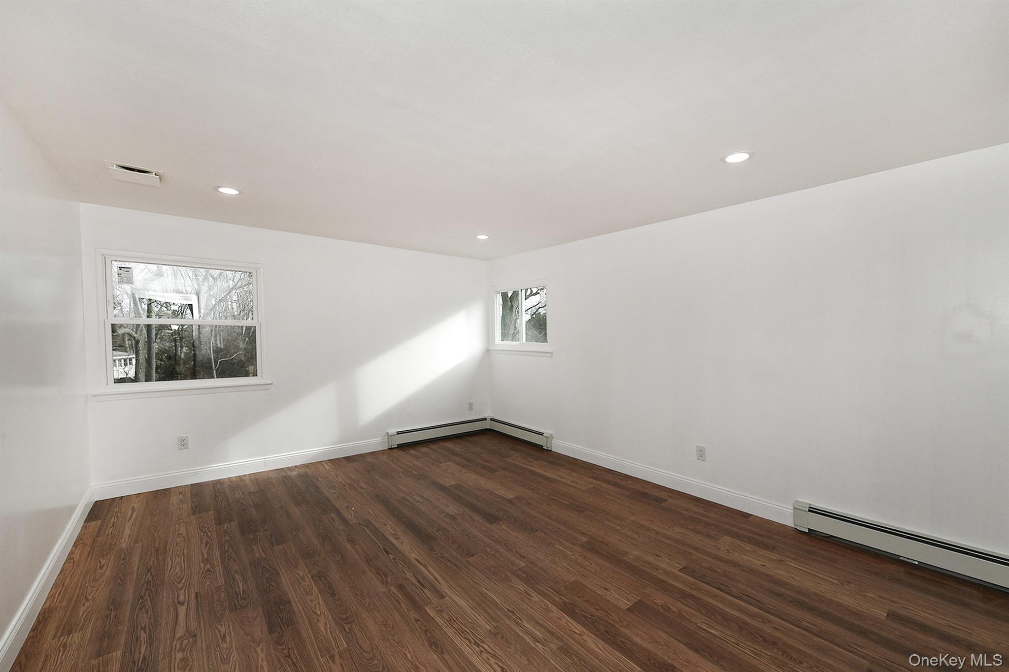 34 Warner Road Huntington, NY 11743 - Photo 21 of 39 an empty room with wooden floor and windows