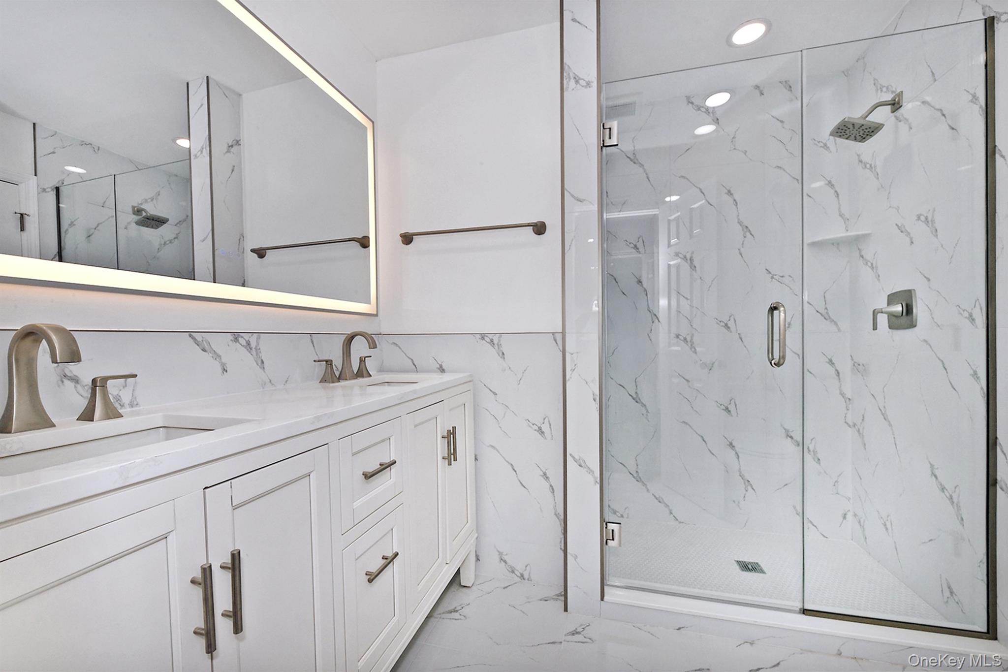 34 Warner Road Huntington, NY 11743 - Photo 24 of 39 a spacious bathroom with a shower sink and mirror