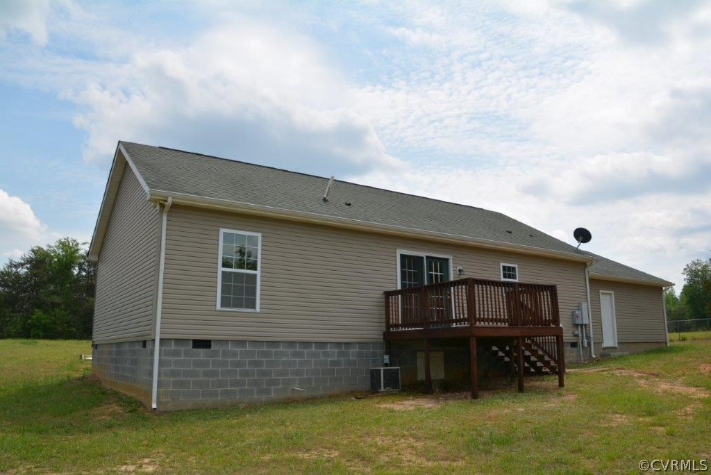 2372 Stage Coach Road Farmville, VA 23901 - Photo 13 of 13 a backyard of a house with barbeque oven and roof