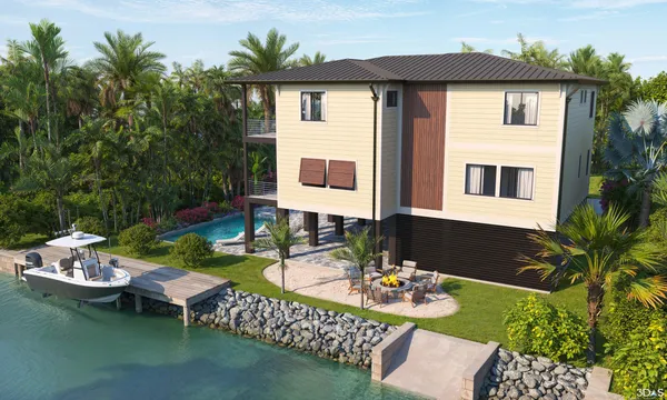 a view of a house with patio furniture and garden