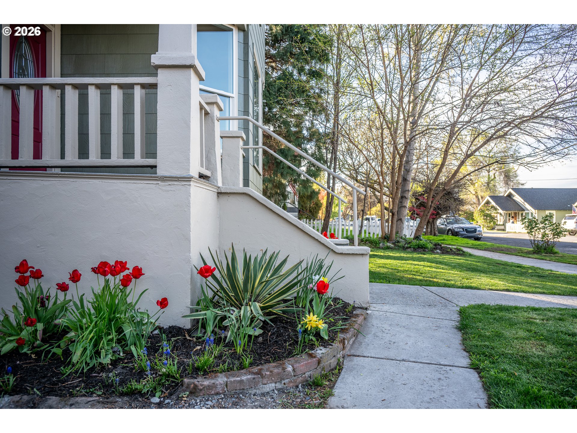 110 West 8th Street The Dalles, OR 97058 - Photo 34 of 43 a picture of flowers in front of a house