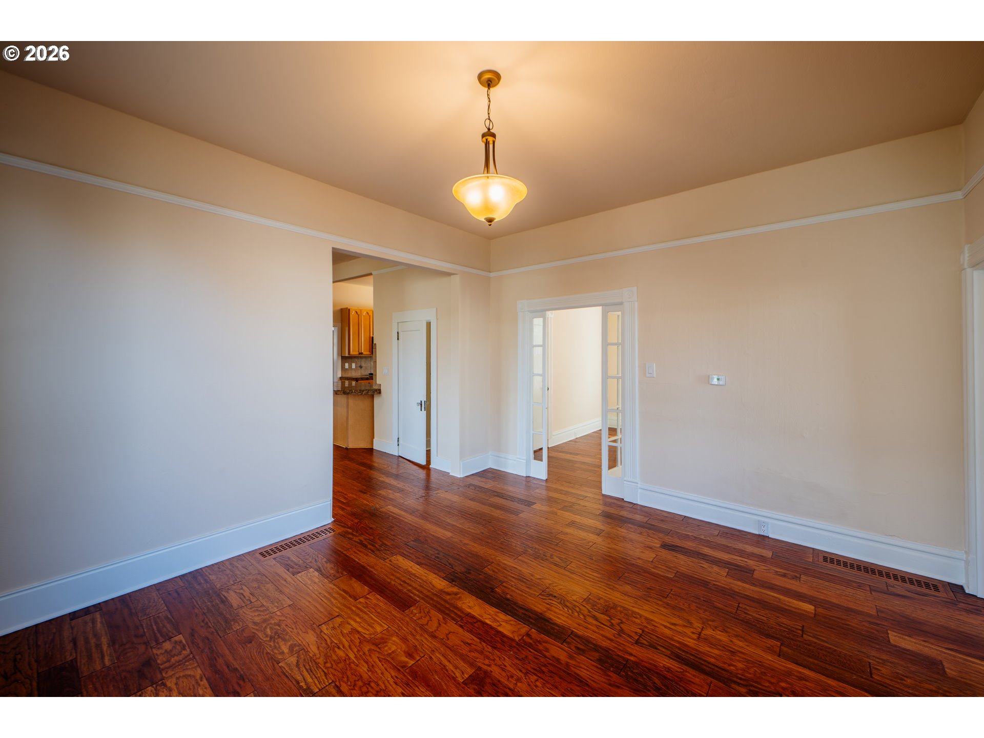110 West 8th Street The Dalles, OR 97058 - Photo 7 of 43 a view of an empty room with wooden floor