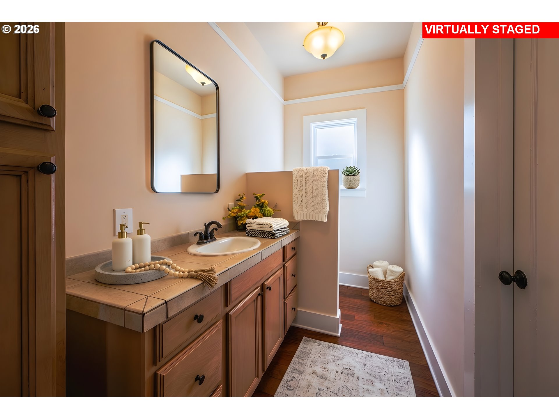 110 West 8th Street The Dalles, OR 97058 - Photo 10 of 43 a bathroom with a sink vanity toilet and a mirror
