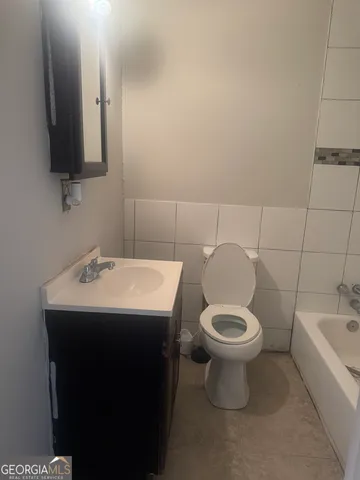 a bathroom with a sink toilet and a bathtub
