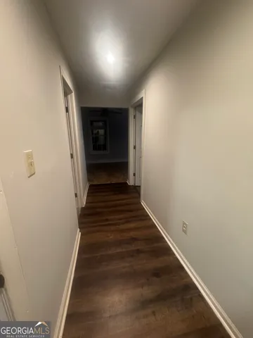 a view of a hallway with stairs