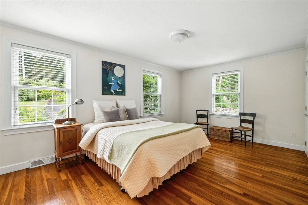 52 Wenham Road Topsfield, MA 01983 - Photo 18 of 42 a bed room with a bed and a chair