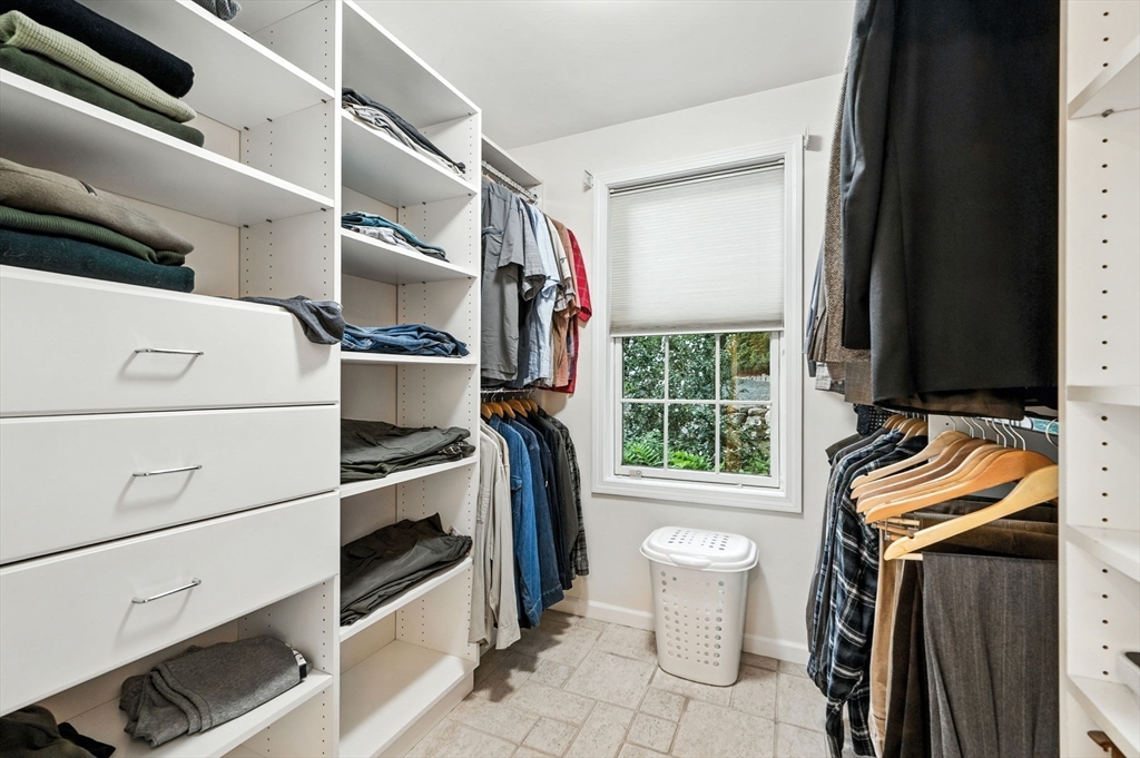 52 Wenham Road Topsfield, MA 01983 - Photo 24 of 42 a view of walk in closet with clothes and shoes
