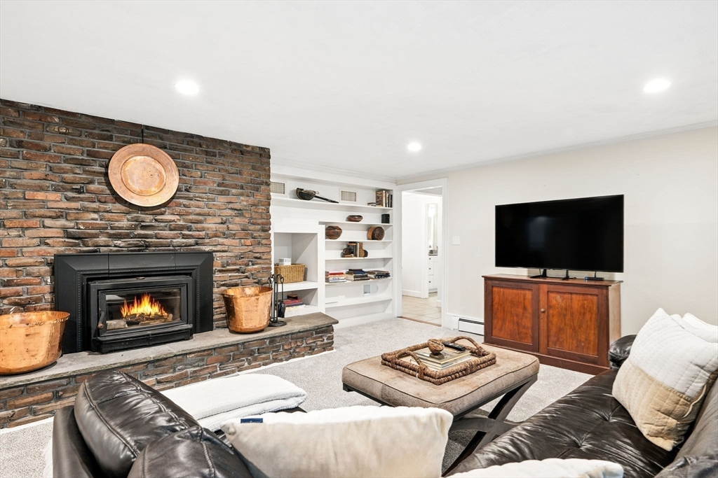 52 Wenham Road Topsfield, MA 01983 - Photo 25 of 42 a living room with furniture and a fireplace