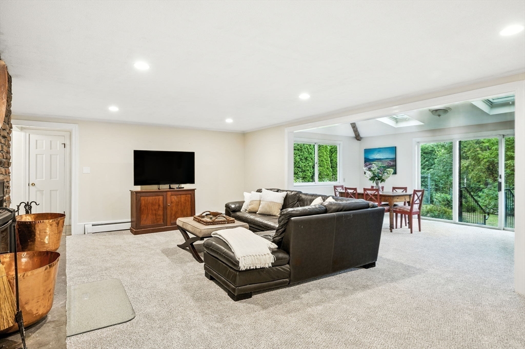 52 Wenham Road Topsfield, MA 01983 - Photo 26 of 42 a living room with furniture and a flat screen tv