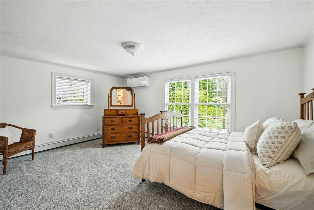 52 Wenham Road Topsfield, MA 01983 - Photo 30 of 42 a bed sitting in a bedroom next to a window