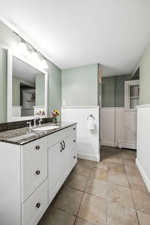 52 Wenham Road Topsfield, MA 01983 - Photo 31 of 42 a spacious bathroom with a granite countertop sink a mirror and a
