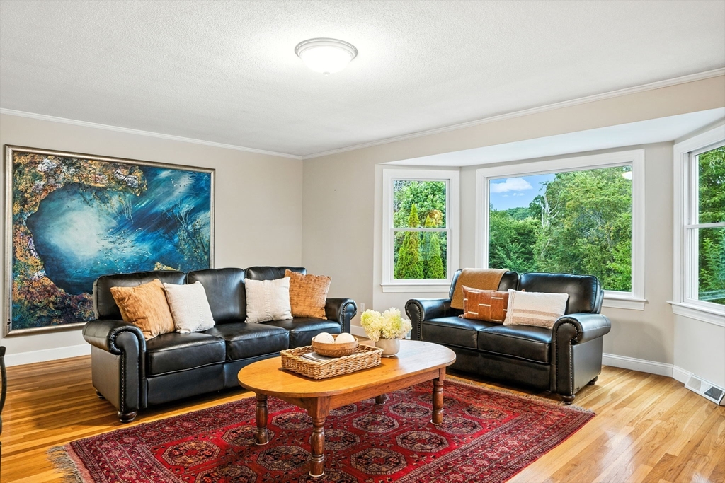 52 Wenham Road Topsfield, MA 01983 - Photo 5 of 42 a living room with furniture and a large window