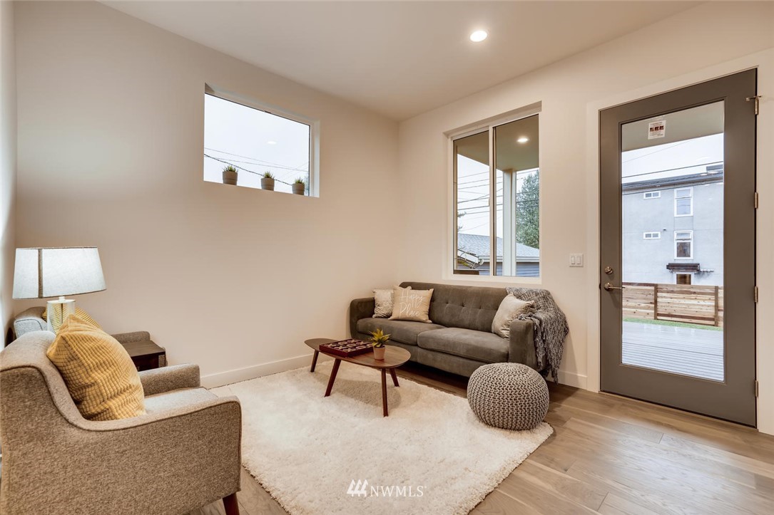 5603 42nd Avenue Southwest Seattle, WA 98136 - Photo 17 of 40 a living room with furniture and a large window