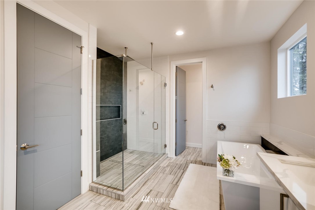 5603 42nd Avenue Southwest Seattle, WA 98136 - Photo 24 of 40 a bathroom with a tub shower and sink