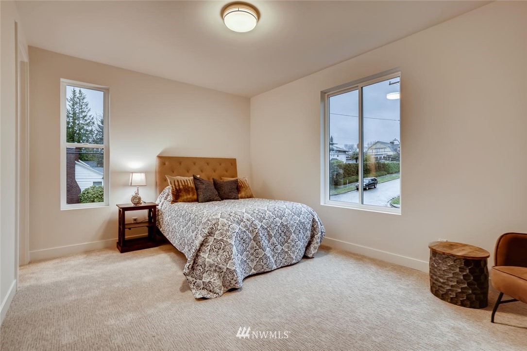 5603 42nd Avenue Southwest Seattle, WA 98136 - Photo 27 of 40 a bedroom with a bed and window