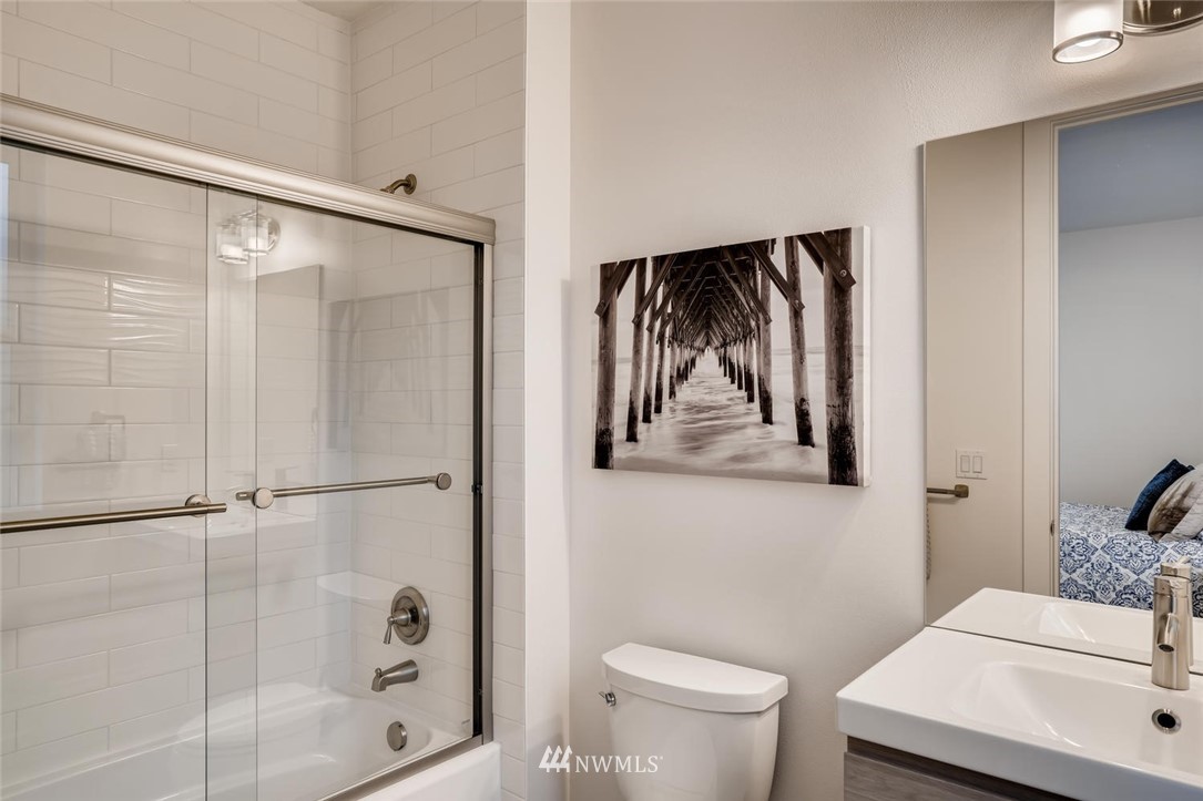 5603 42nd Avenue Southwest Seattle, WA 98136 - Photo 29 of 40 a bathroom with a toilet a sink and shower