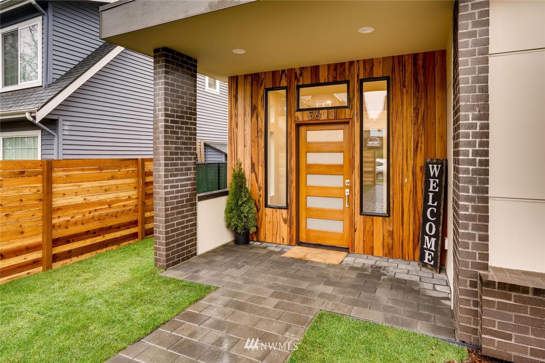 5603 42nd Avenue Southwest Seattle, WA 98136 - Photo 4 of 40 a view of a porch with a door