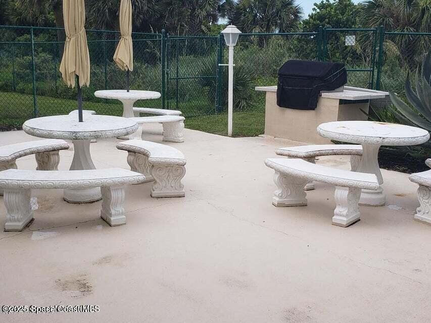 2100 North Atlantic Avenue, Unit 1103 Cocoa Beach, FL 32931 - Photo 22 of 31 Clubhouse patio and BBQ area
