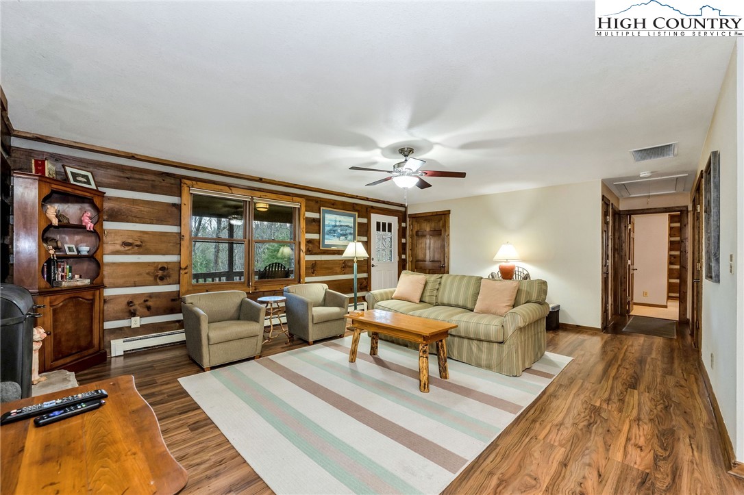 214 Deer Ridge Road Crumpler, NC 28617 - Photo 13 of 44 a living room with furniture and wooden floor