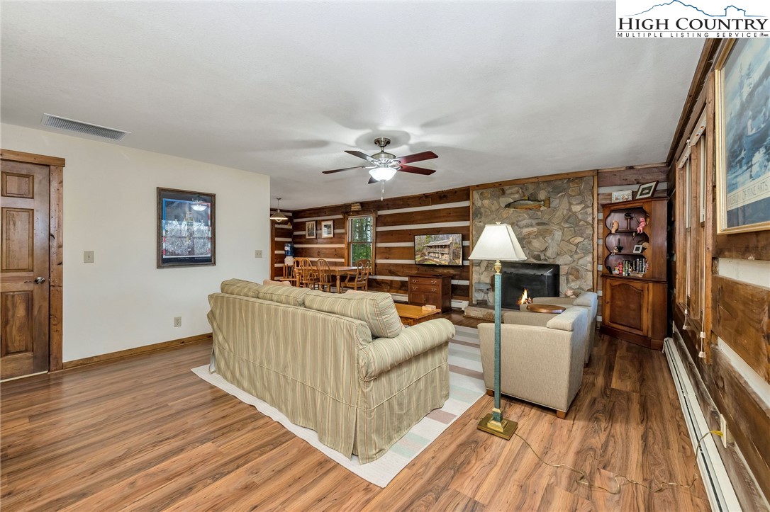 214 Deer Ridge Road Crumpler, NC 28617 - Photo 15 of 44 a living room with furniture and a floor to ceiling window