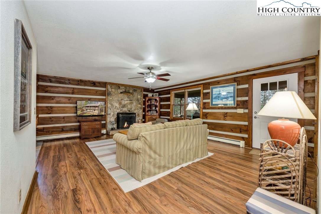 214 Deer Ridge Road Crumpler, NC 28617 - Photo 16 of 44 a living room with furniture and wooden floor