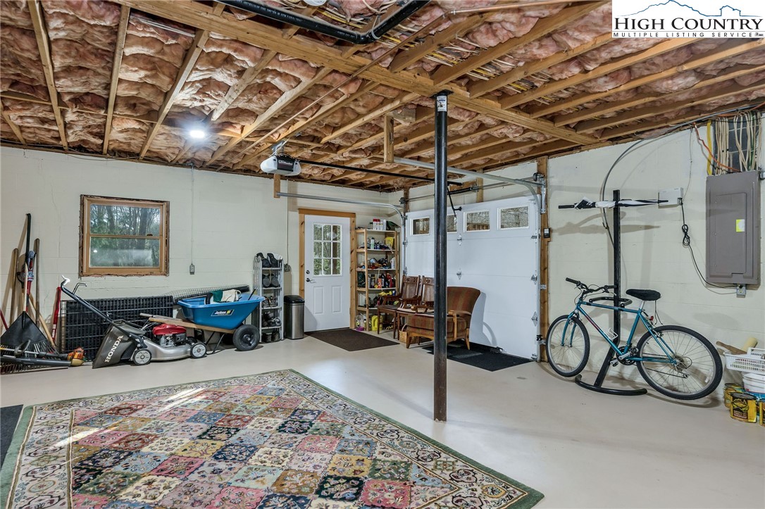 214 Deer Ridge Road Crumpler, NC 28617 - Photo 25 of 44 a view of a room with gym equipment