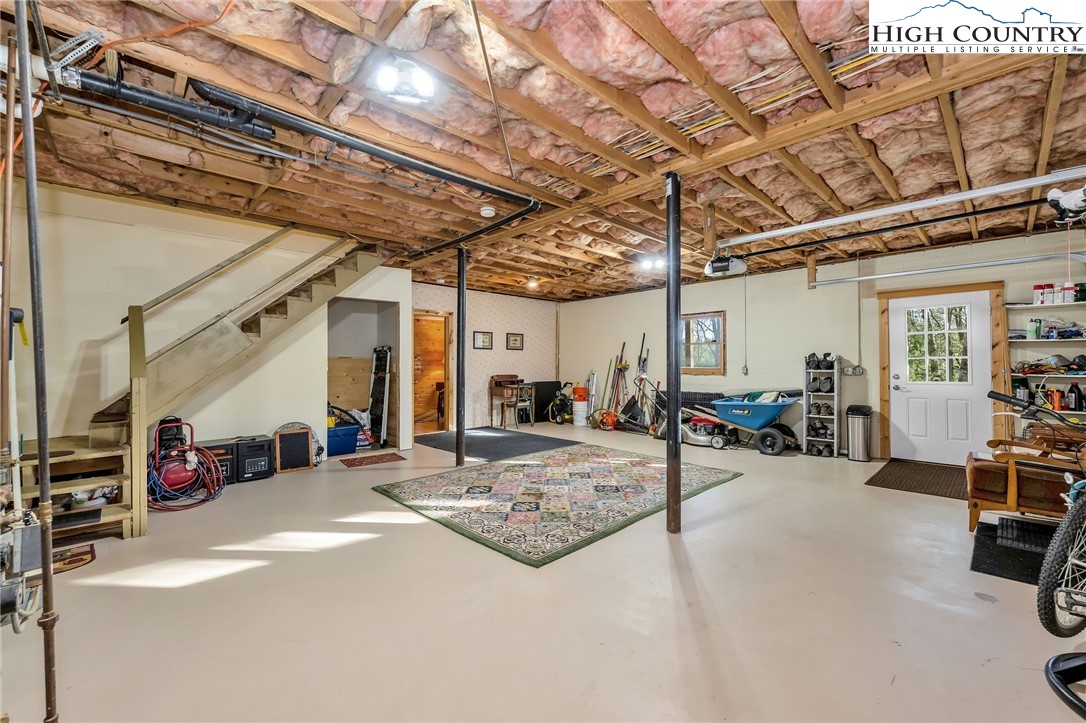 214 Deer Ridge Road Crumpler, NC 28617 - Photo 26 of 44 a view of a room with gym equipment