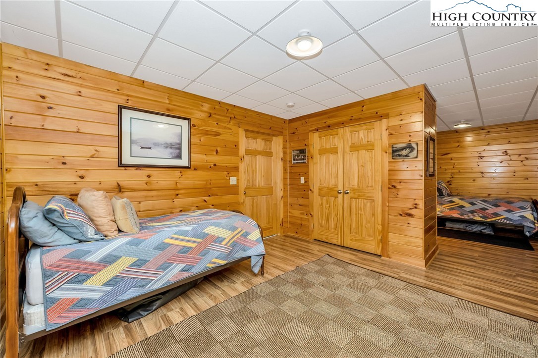 214 Deer Ridge Road Crumpler, NC 28617 - Photo 29 of 44 a bedroom with a bed and a walk in closet