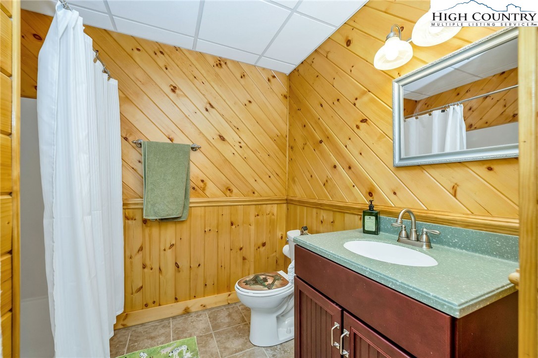 214 Deer Ridge Road Crumpler, NC 28617 - Photo 32 of 44 a bathroom with a sink and a mirror