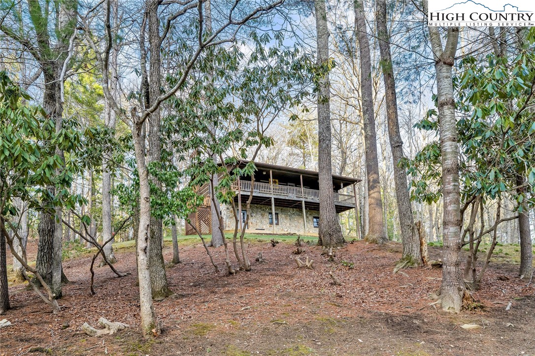 214 Deer Ridge Road Crumpler, NC 28617 - Photo 41 of 44 a front view of a house with a yard
