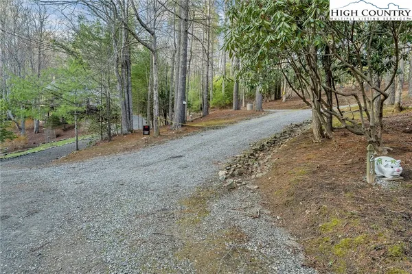 a view of a field with trees in front of it