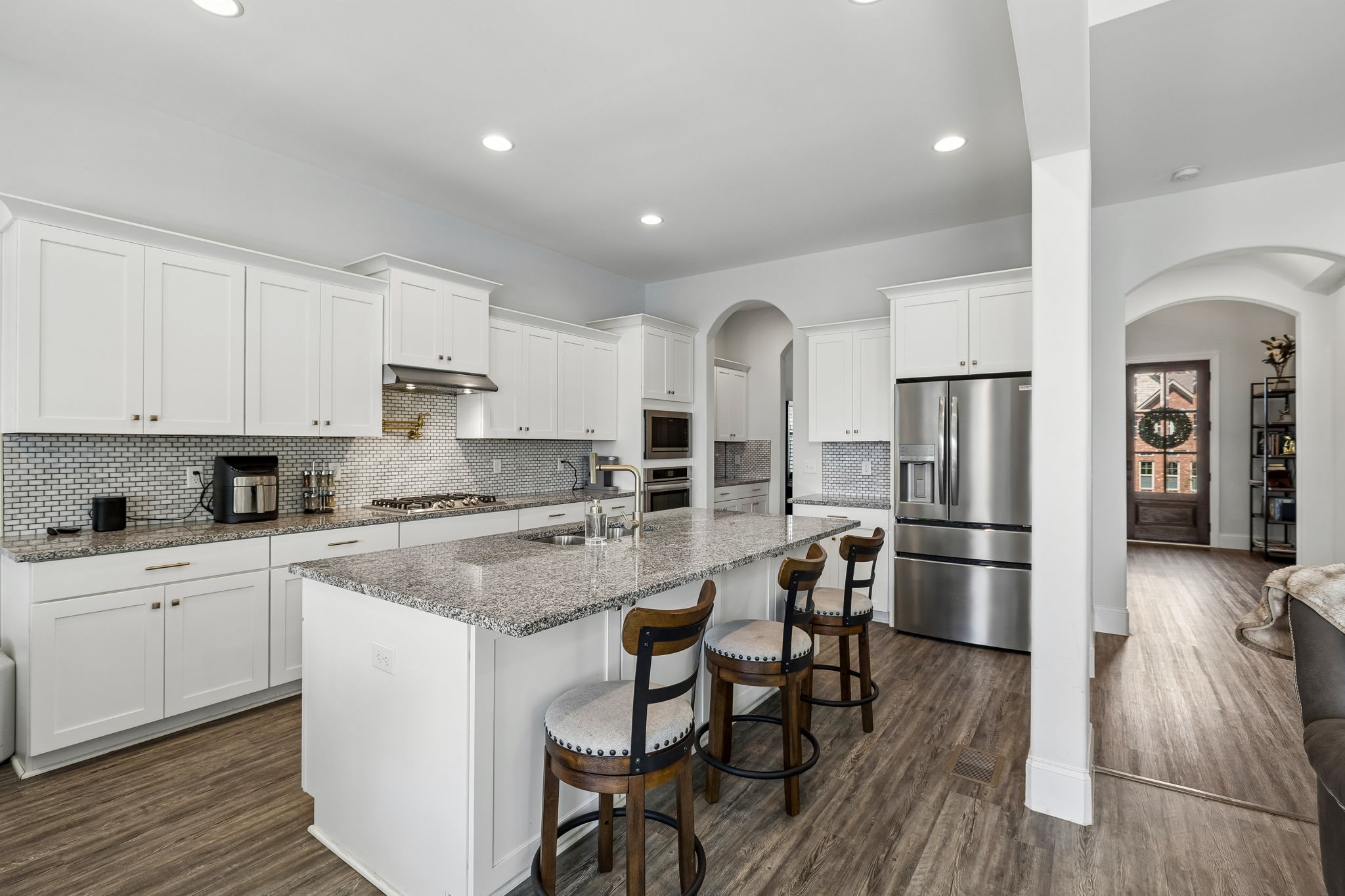 1008 Quillen Way Lebanon, TN 37087 - Photo 13 of 54 a kitchen with stainless steel appliances a stove a sink a refrigerator and cabinets