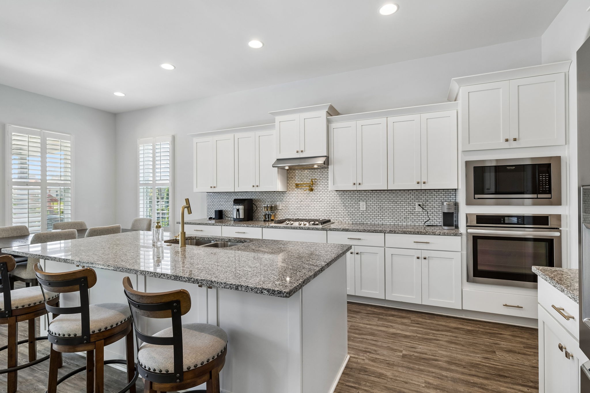 1008 Quillen Way Lebanon, TN 37087 - Photo 16 of 54 a kitchen with granite countertop a stove sink and microwave