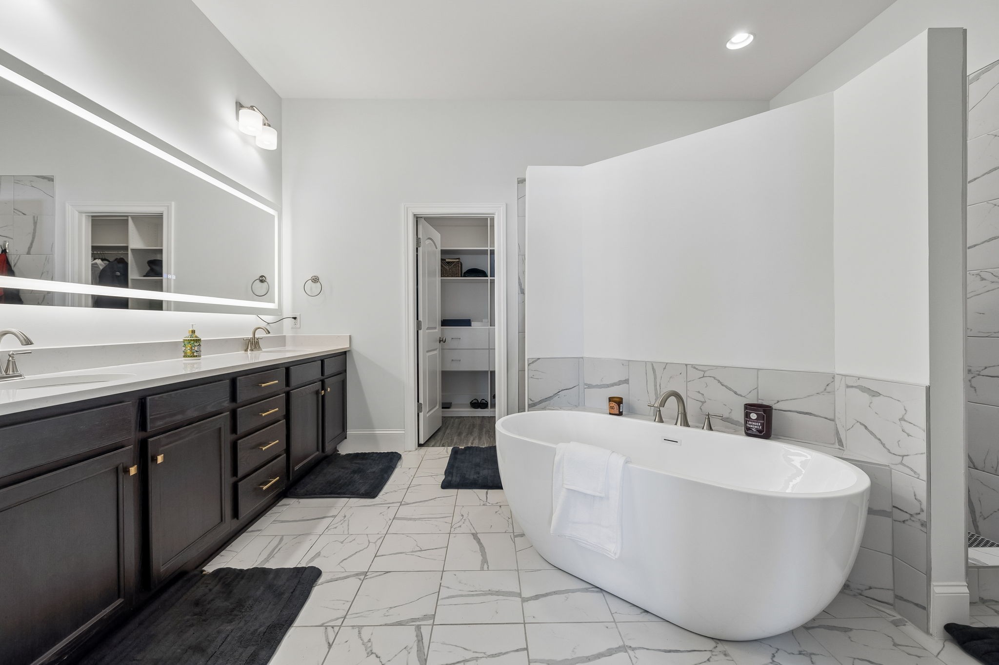1008 Quillen Way Lebanon, TN 37087 - Photo 20 of 54 a bathroom with a tub sink and mirror