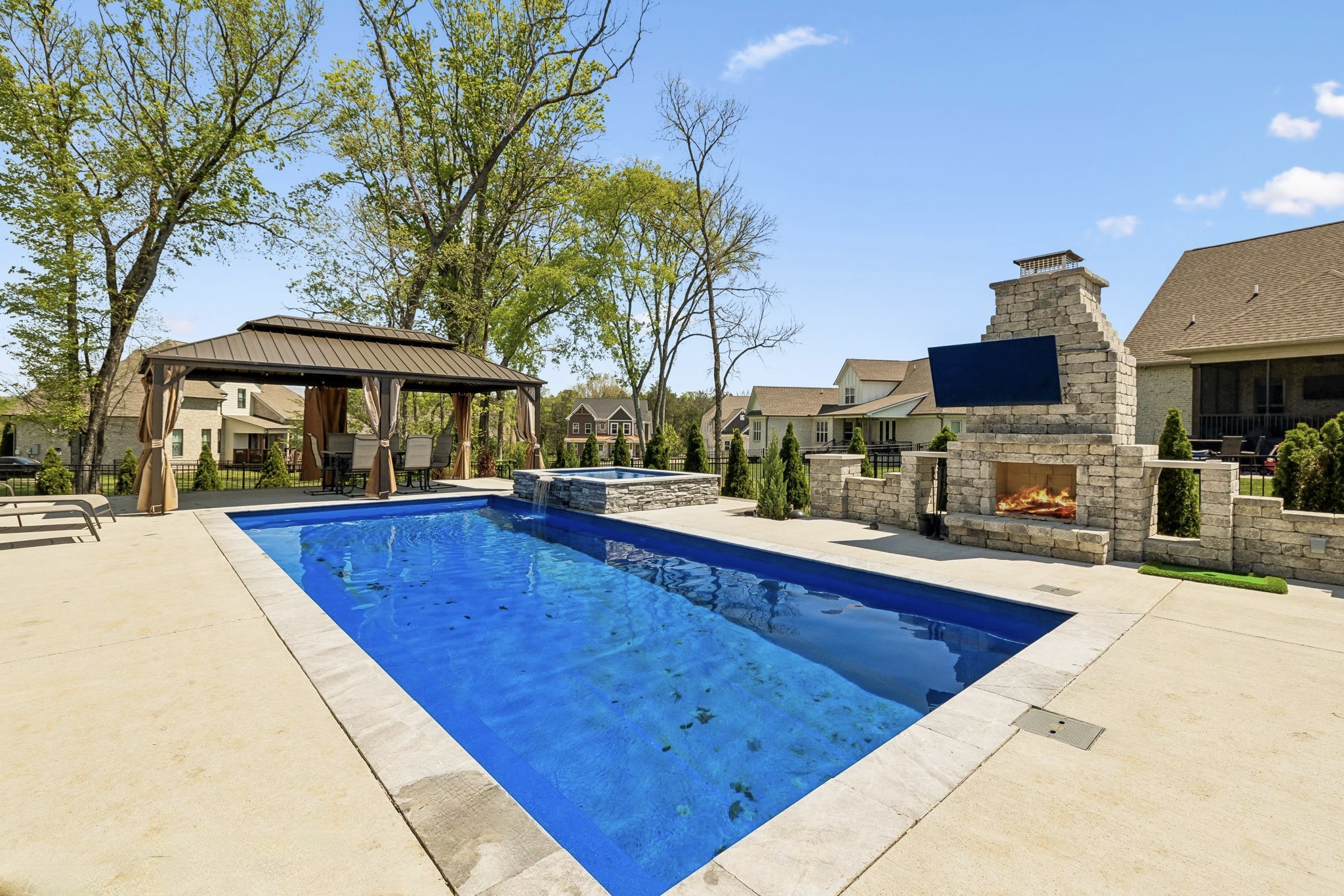 1008 Quillen Way Lebanon, TN 37087 - Photo 2 of 54 a view of swimming pool with outdoor seating and house in the background