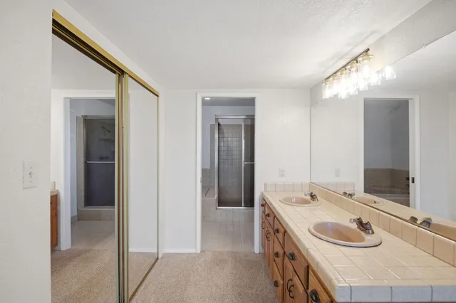 a view of staircase with railing and a window