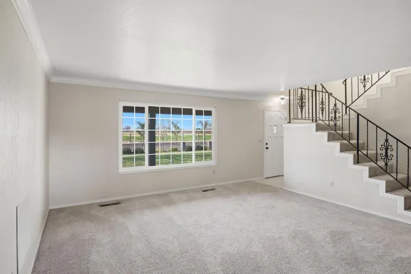 a view of an empty room with a window
