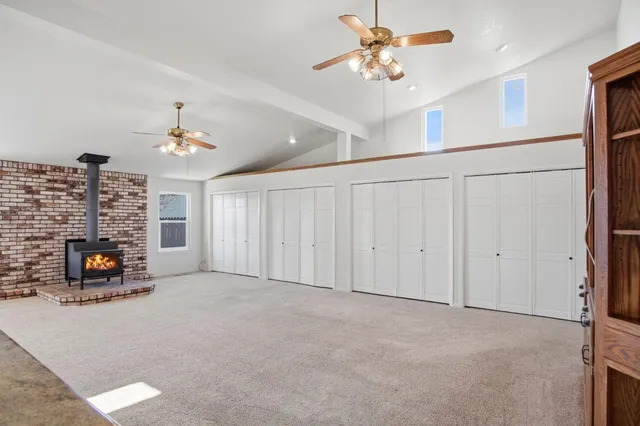 a view of a livingroom with furniture and a fireplace