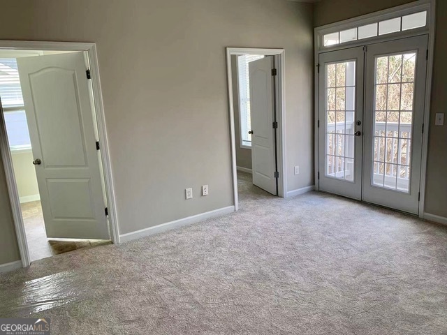 177 Dunleith Parkway Southwest Marietta, GA 30008 - Photo 11 of 17 an empty room with windows and closet