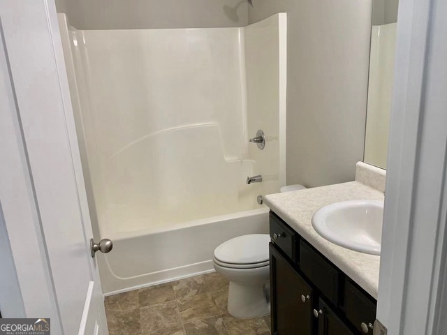 177 Dunleith Parkway Southwest Marietta, GA 30008 - Photo 12 of 17 a bathroom with a sink a toilet and shower