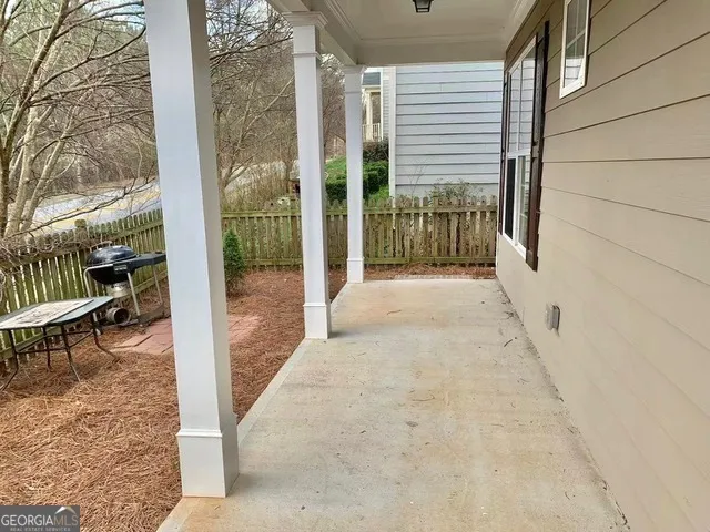 a view of a porch with a bench
