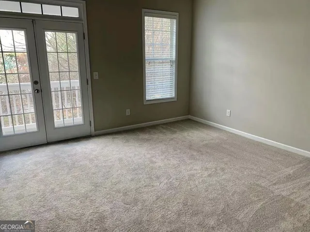 an empty room with windows