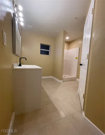 an empty room with a bathroom