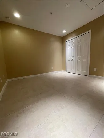 a white bath tub sitting next to a white sink and vanity