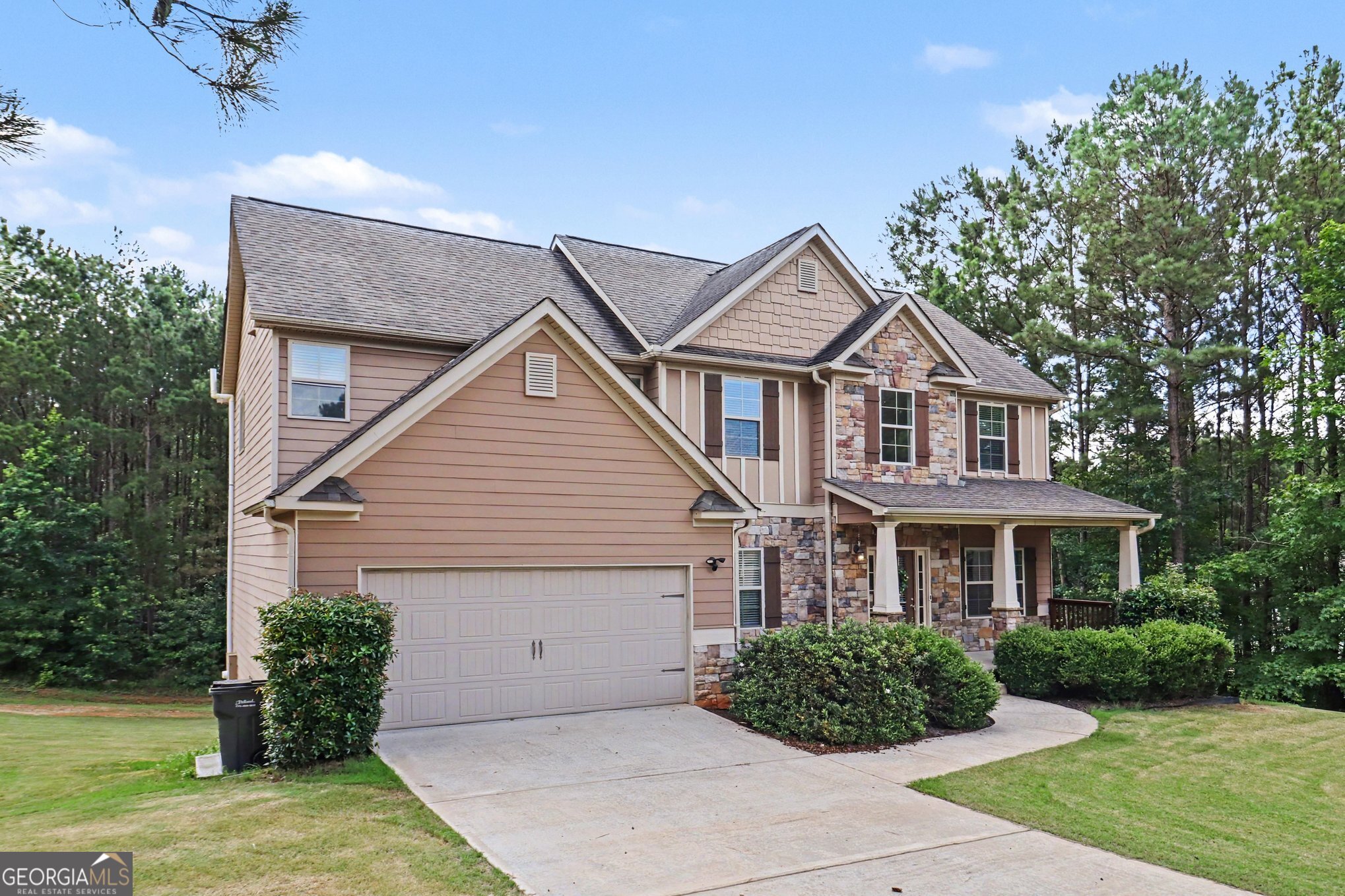 207 George Wynn Road Palmetto, GA 30268 - Photo 2 of 32 a front view of a house with a garden