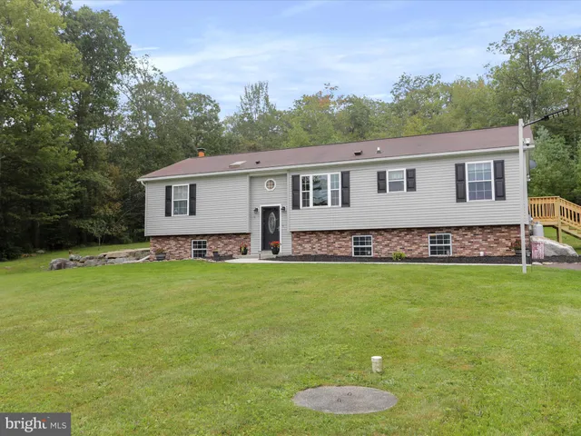 a view of a garage with a white car parked