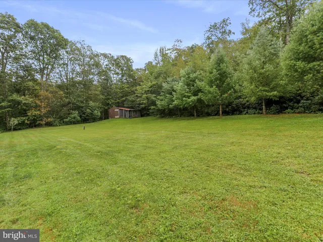 a view of a field with an outdoor space