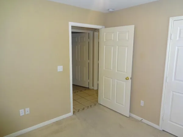 an empty room with closet area